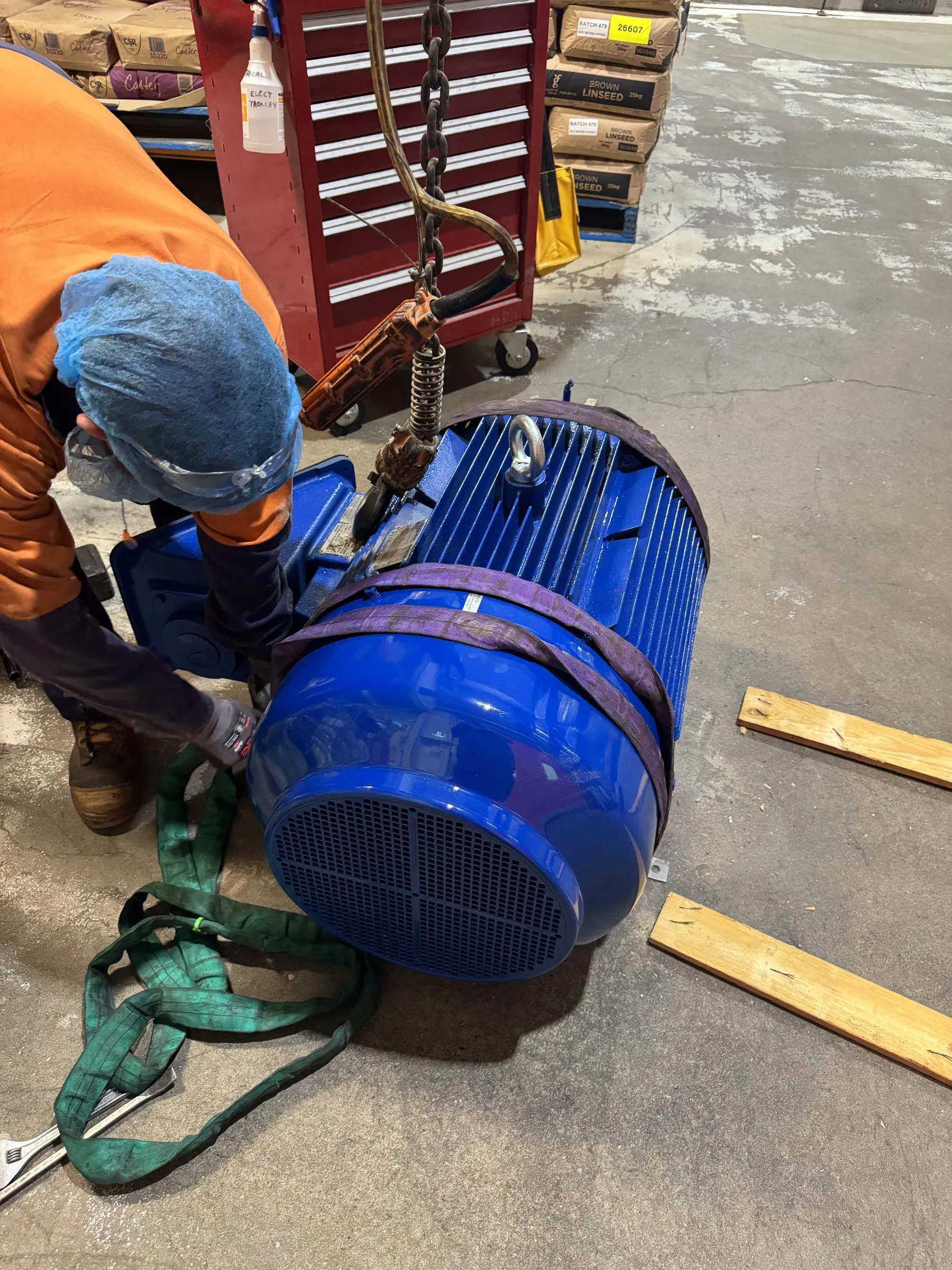 Motor being slung and positioned for installation